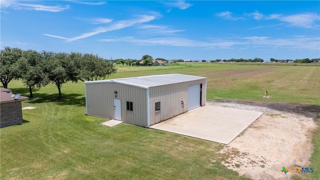 99 N Seakist Ln, Port Lavaca, TX 77979 - view of outdoor structure featuring driveway and a rural view
