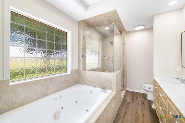 99 N Seakist Ln, Port Lavaca, TX 77979 - full bathroom with a whirlpool tub, vanity, a stall shower, and wood finished floors