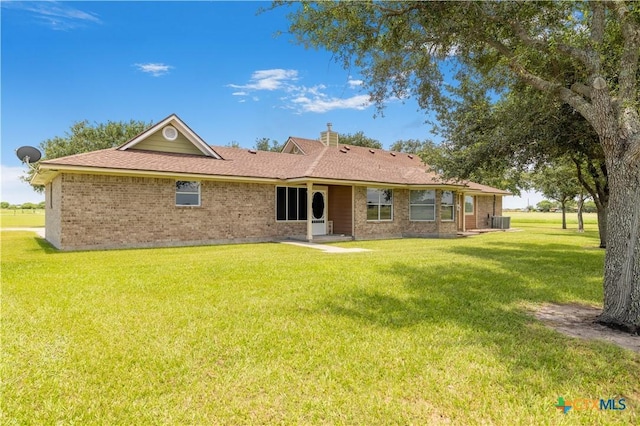 99 N Seakist Ln, Port Lavaca, TX 77979 - back of house with a yard and brick siding