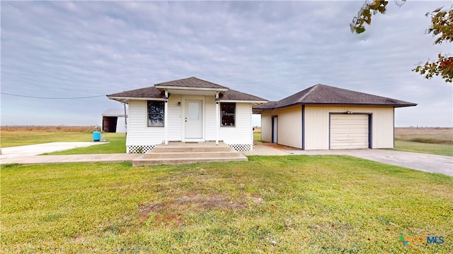 view of front facade with a garage and a front lawn