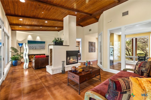 10329 Montanio Dr, New Braunfels, TX 78132 - living area featuring a wood ceiling with exposed beams, a multi sided fireplace, high vaulted ceiling, and recessed lighting