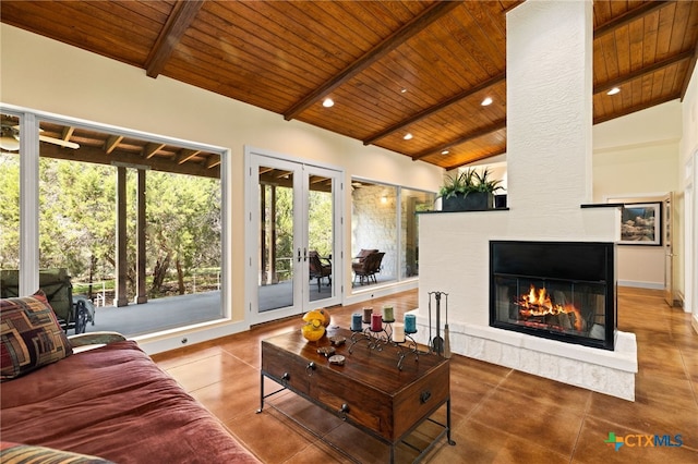 10329 Montanio Dr, New Braunfels, TX 78132 - living room with wood ceiling, a large fireplace, french doors, tile patterned flooring, and recessed lighting