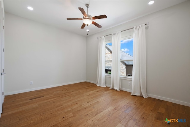 empty room featuring light hardwood / wood-style floors and ceiling fan