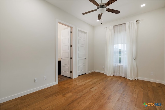 unfurnished bedroom with light hardwood / wood-style floors and ceiling fan