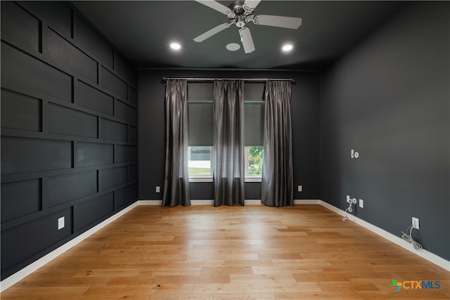 empty room featuring light hardwood / wood-style floors and ceiling fan