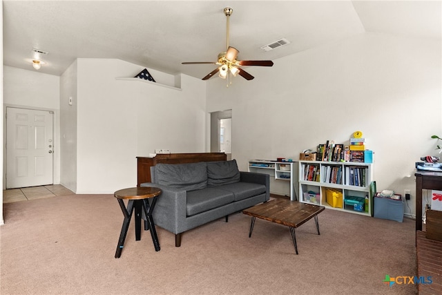 living area with light colored carpet, lofted ceiling, and ceiling fan