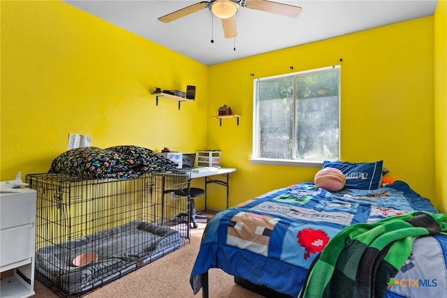 bedroom with ceiling fan and carpet flooring