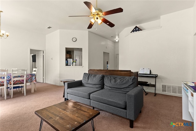 living room with carpet flooring and ceiling fan with notable chandelier