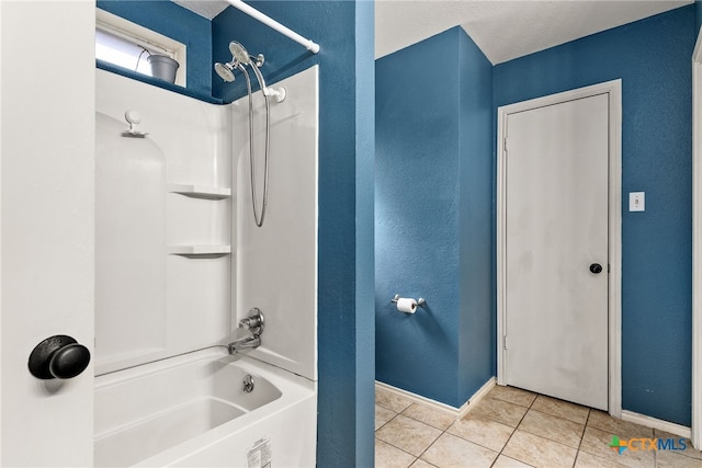 bathroom featuring tile patterned floors and bathtub / shower combination