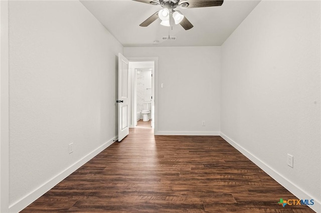 unfurnished bedroom featuring dark hardwood / wood-style floors and ceiling fan