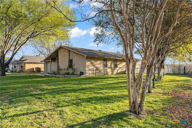 view of property exterior with a lawn