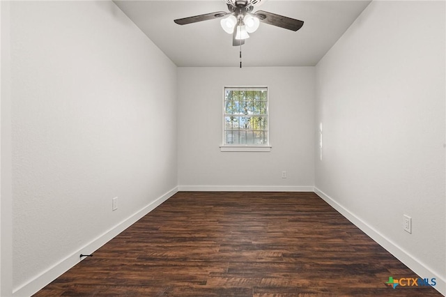 spare room with ceiling fan and dark wood-type flooring