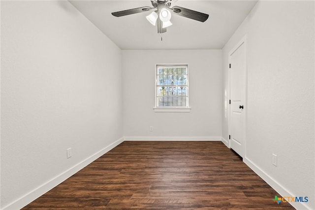 unfurnished room with ceiling fan and dark hardwood / wood-style floors