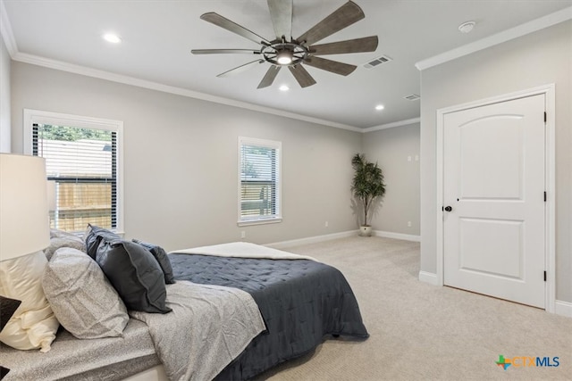 carpeted bedroom featuring ceiling fan, multiple windows, and crown molding