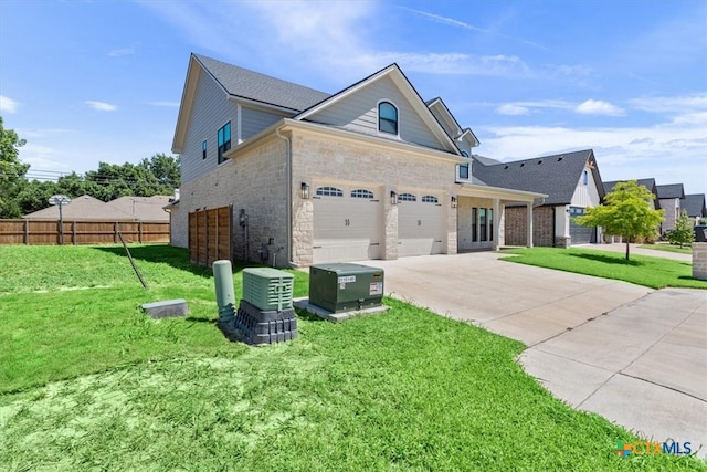 view of front of house with a garage and a front yard