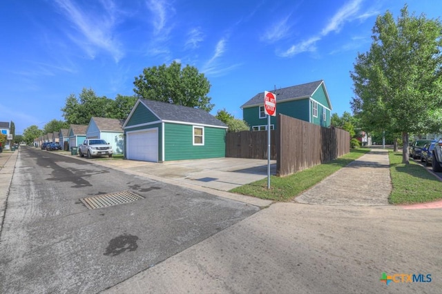 exterior space with traffic signs, sidewalks, and curbs