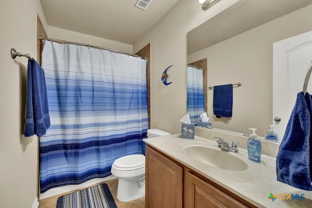bathroom with visible vents, a shower with shower curtain, toilet, and vanity