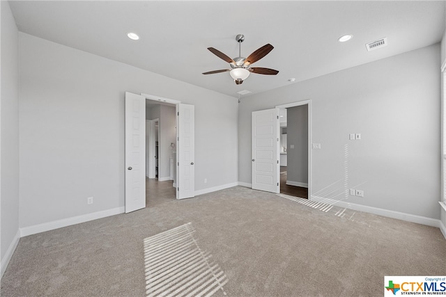 unfurnished bedroom featuring ceiling fan and carpet floors