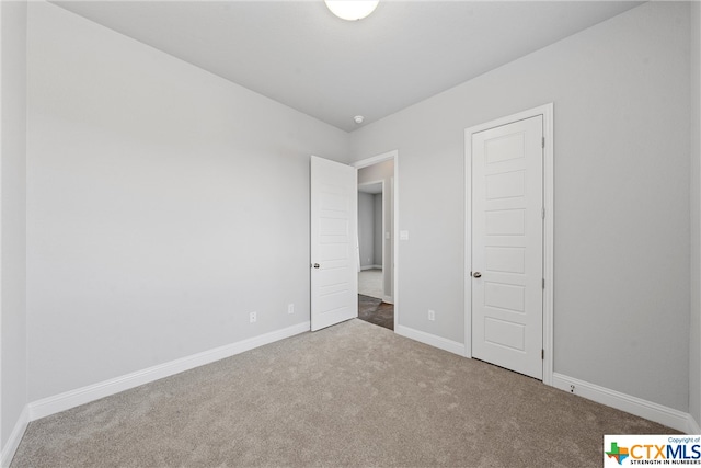 unfurnished bedroom with carpet floors