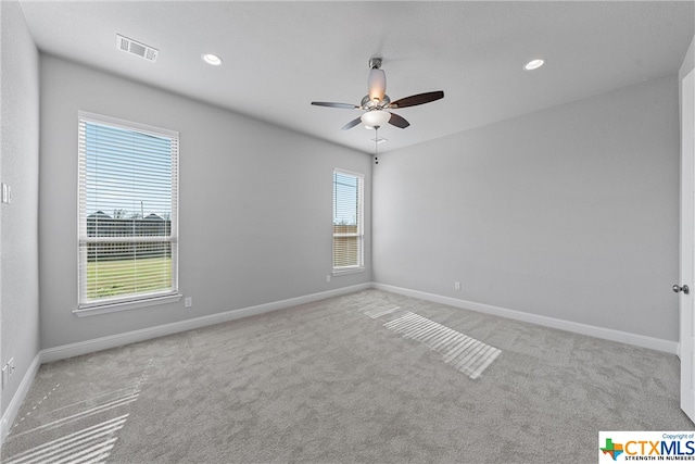 carpeted empty room featuring ceiling fan