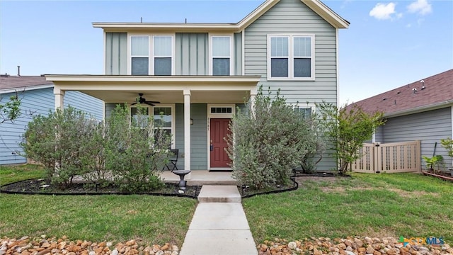 1381 Nevarez, Kyle, TX 78640 - traditional-style house featuring fence, covered porch, ceiling fan, and a front lawn