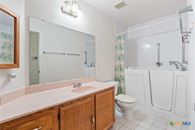 full bathroom featuring separate shower and tub, toilet, tile patterned floors, and vanity