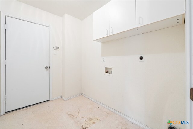 laundry room with hookup for a washing machine, hookup for an electric dryer, and cabinets