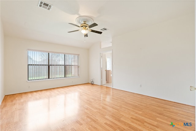 spare room with light wood-type flooring and ceiling fan