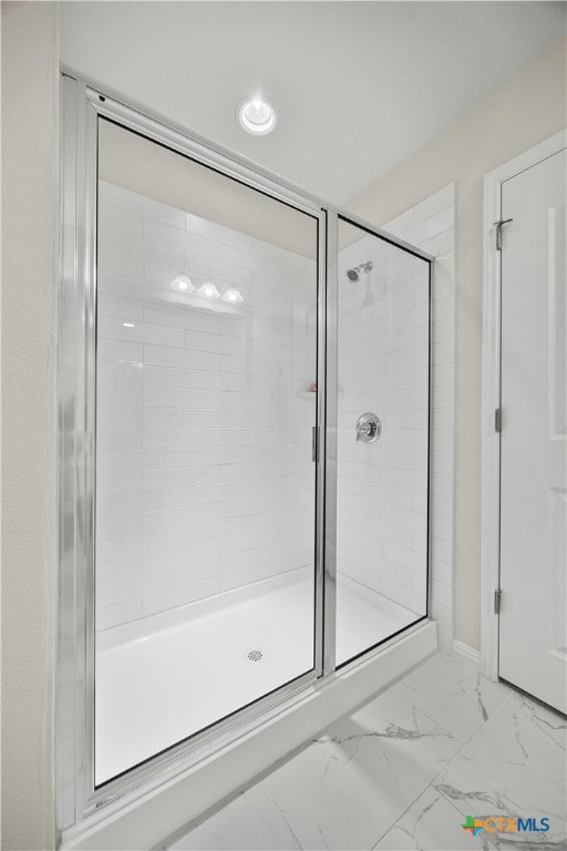 324 Brenham Pass, Georgetown, TX 78633 - bathroom featuring marble finish floor and a stall shower