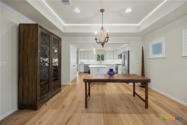 324 Brenham Pass, Georgetown, TX 78633 - home office with visible vents, baseboards, light wood-type flooring, a chandelier, and a tray ceiling