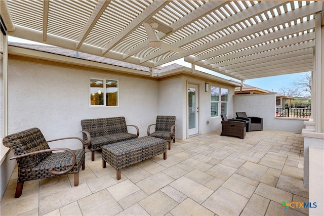 view of patio with an outdoor living space and a pergola