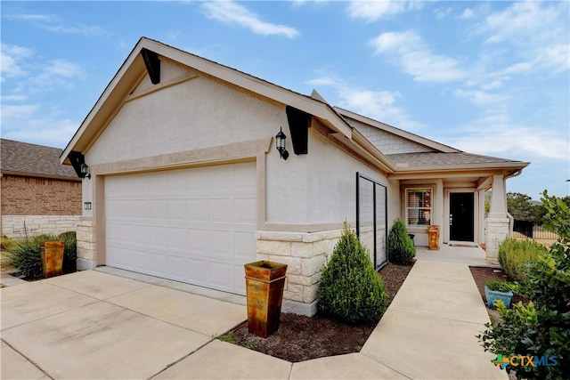 324 Brenham Pass, Georgetown, TX 78633 - ranch-style home with an attached garage, stucco siding, driveway, and stone siding