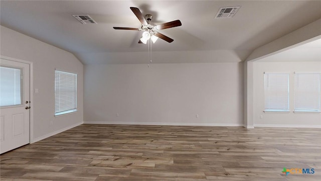 interior space with hardwood / wood-style flooring, ceiling fan, and vaulted ceiling