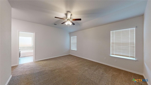 spare room with carpet floors and ceiling fan