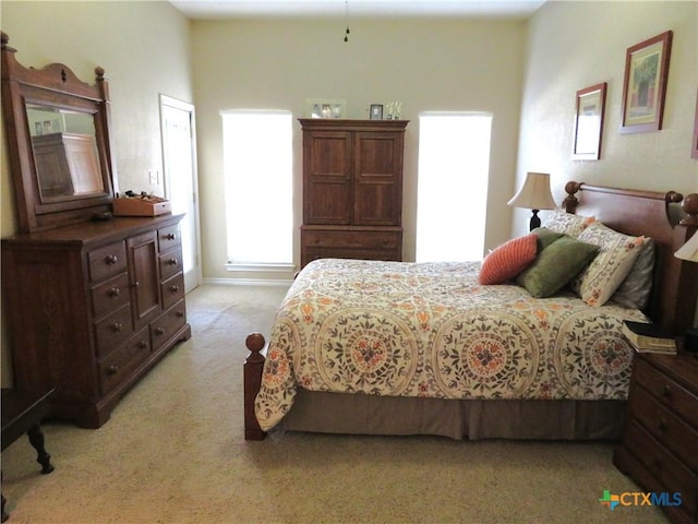 bedroom with light carpet