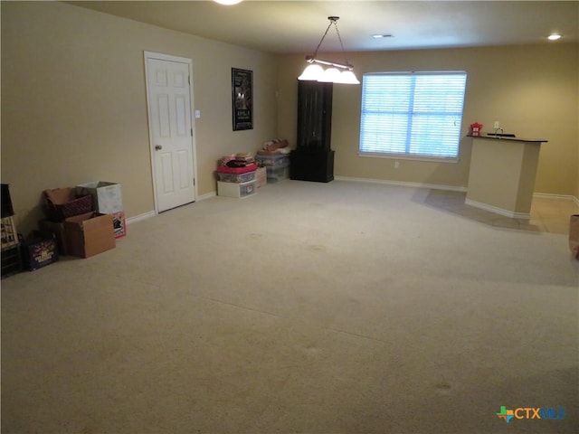 interior space featuring light colored carpet