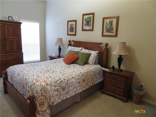 bedroom with light colored carpet