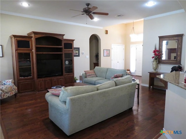 living room featuring crown molding, ceiling fan, and dark hardwood / wood-style flooring