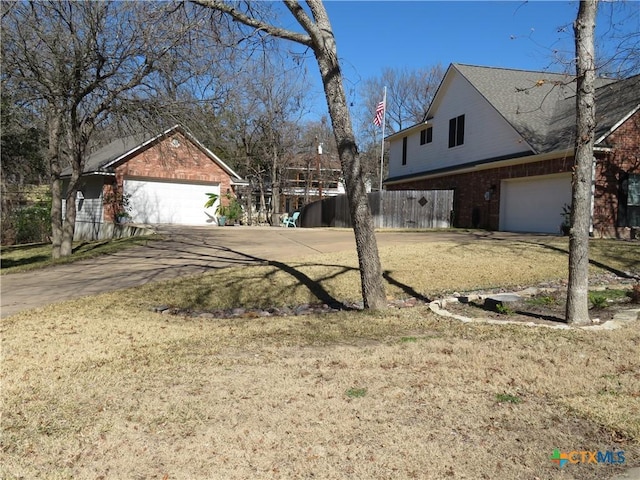 view of side of home featuring a lawn