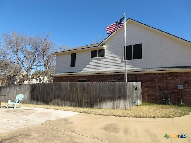 view of property exterior featuring a patio area