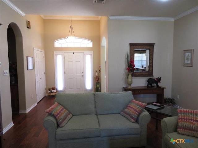 living room featuring crown molding, a healthy amount of sunlight, and dark hardwood / wood-style flooring