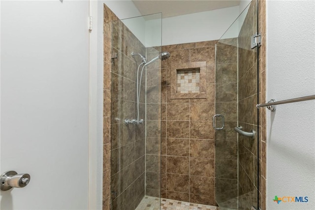 full bathroom with a shower stall