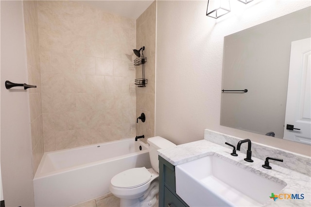 full bathroom featuring toilet, vanity, and tiled shower / bath