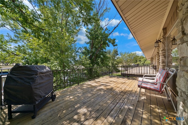 wooden deck with area for grilling