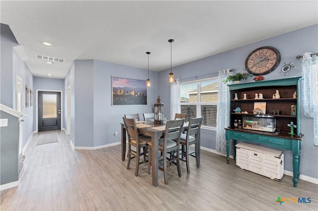 dining room featuring light hardwood / wood-style flooring