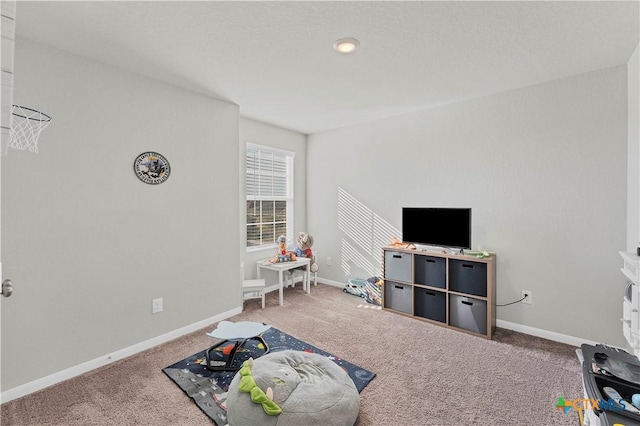 recreation room with carpet flooring