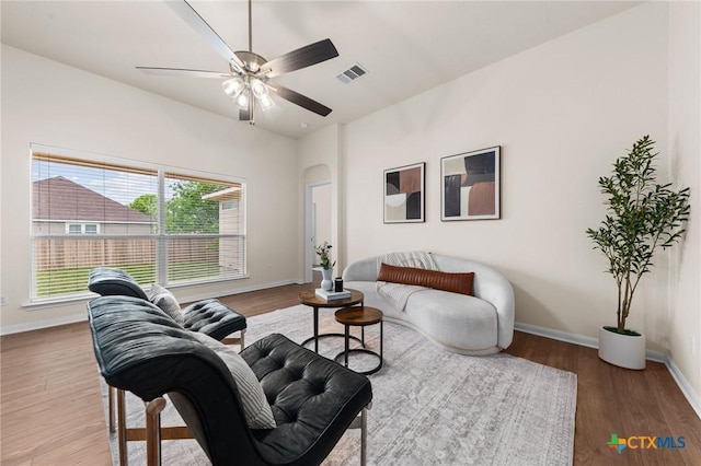 8003 Bridgepointe Dr, Temple, TX 76502 - living area featuring baseboards, a ceiling fan, wood finished floors, and visible vents
