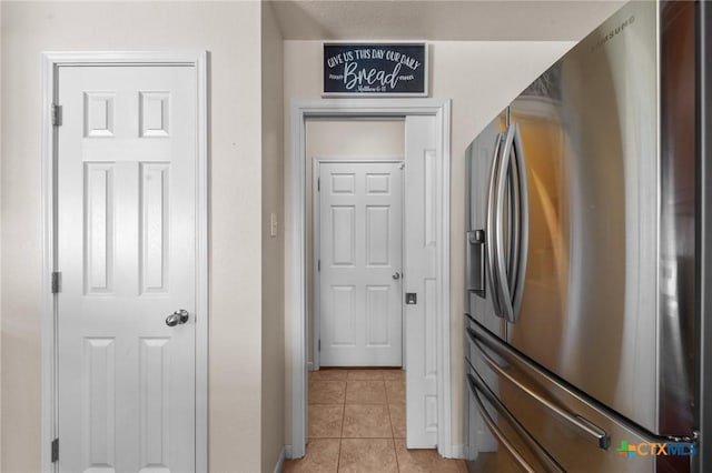 8003 Bridgepointe Dr, Temple, TX 76502 - kitchen with stainless steel refrigerator with ice dispenser, baseboards, and light tile patterned flooring