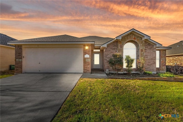 8003 Bridgepointe Dr, Temple, TX 76502 - view of front of home featuring concrete driveway, an attached garage, stone siding, brick siding, and a front yard