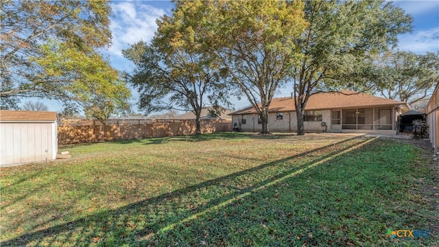 view of yard with a sunroom